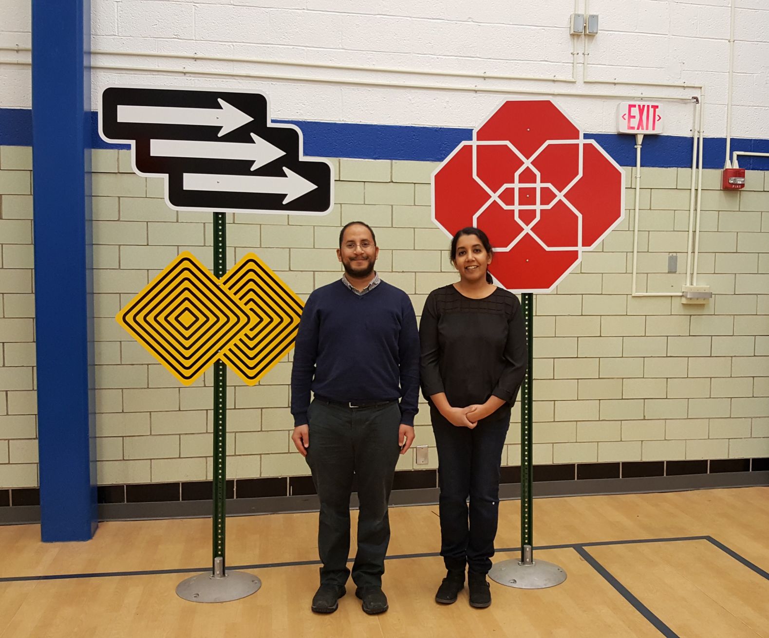 Gautam and Sameema Rao in front of Gautam Rao's work at Englewood Recreation Indy